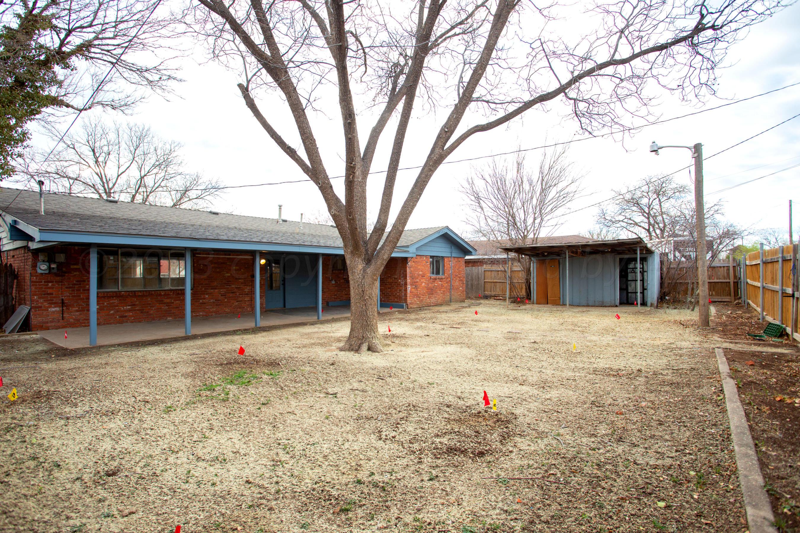 3624 Sunlite Street Amarillo, TX 79109 - Photo 25 of 25 a front view of a house with a yard and garage