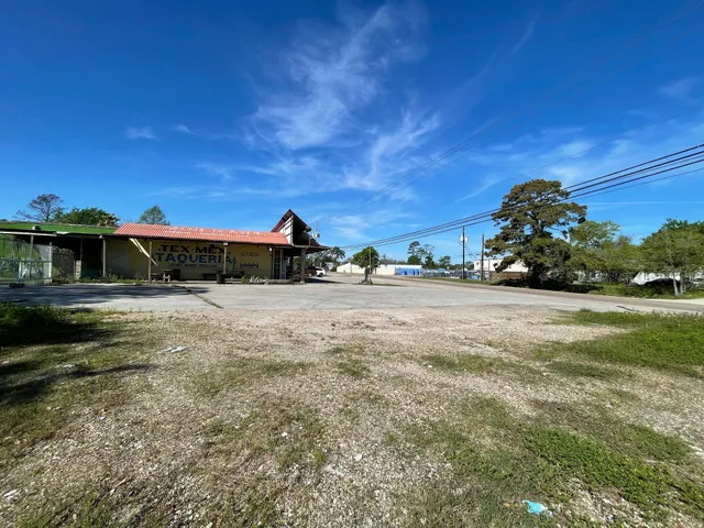 a view of a street with a building in the background