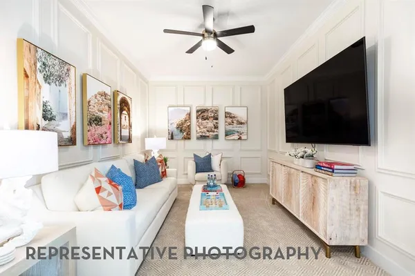 a living room with furniture and a flat screen tv