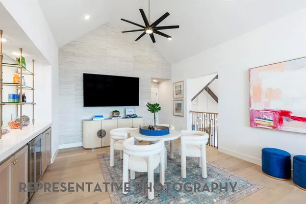 a view of a livingroom with furniture and a flat screen tv