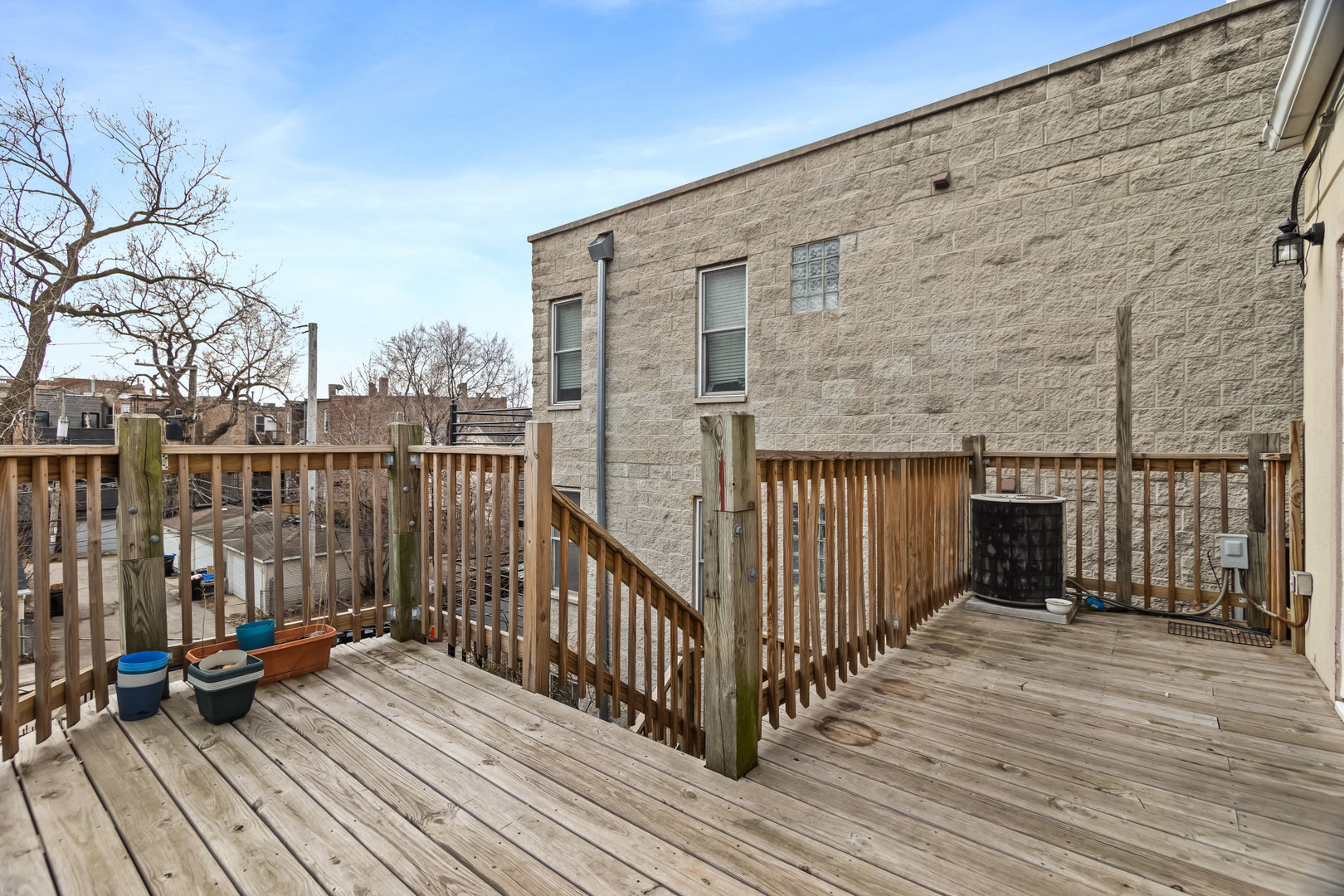 2247 West Monroe Street, Unit 3 Chicago, IL 60612 - Photo 17 of 31 a view of a balcony with wooden floor and fence
