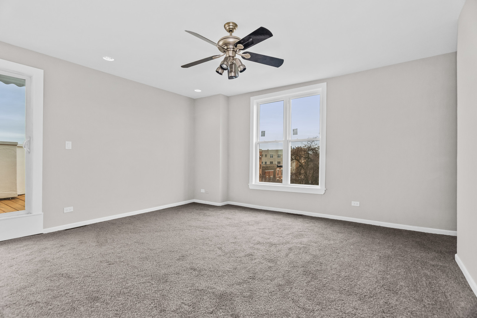 2247 West Monroe Street, Unit 3 Chicago, IL 60612 - Photo 19 of 31 an empty room with fan and windows