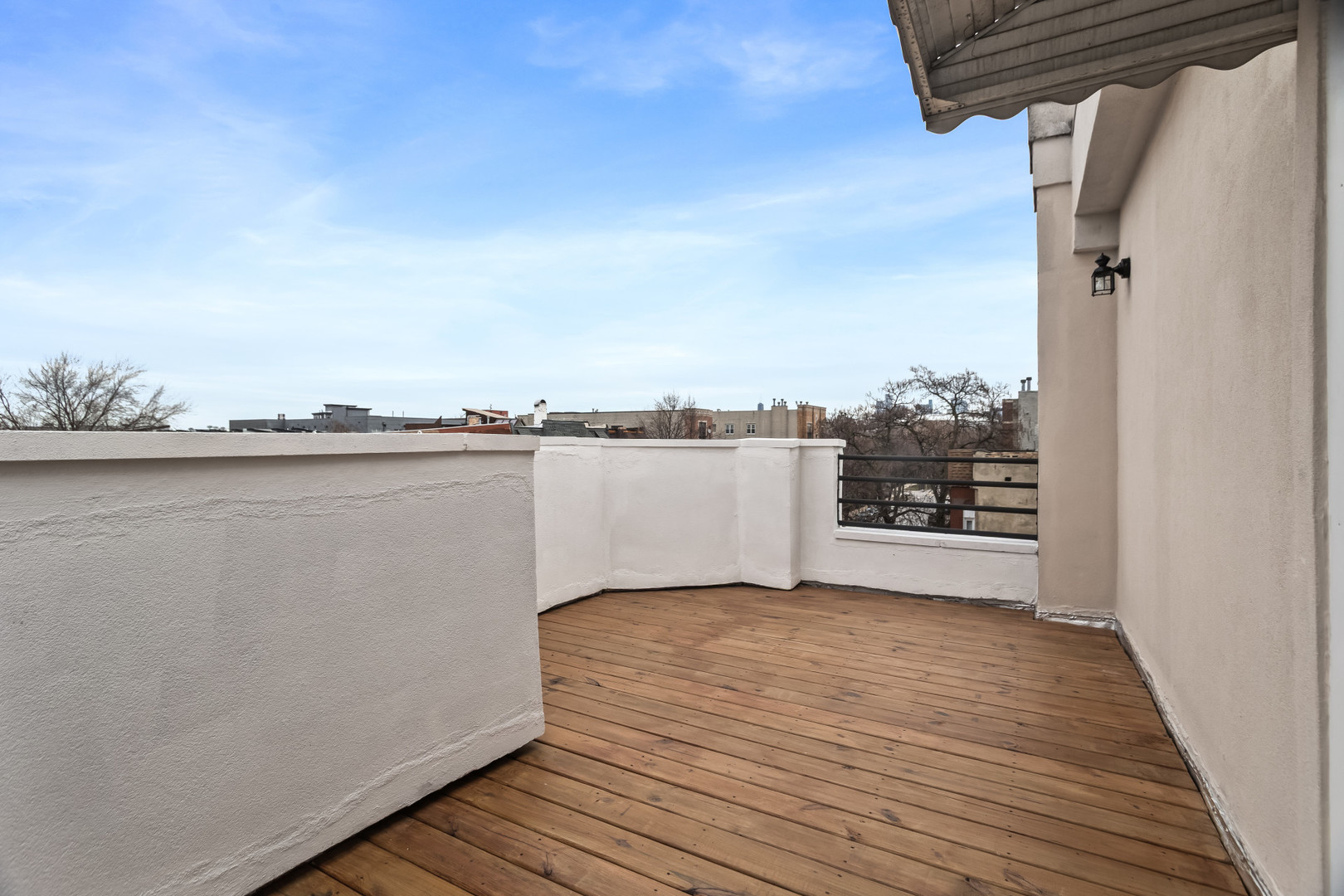 2247 West Monroe Street, Unit 3 Chicago, IL 60612 - Photo 22 of 31 a view of a terrace with wooden floor and fence