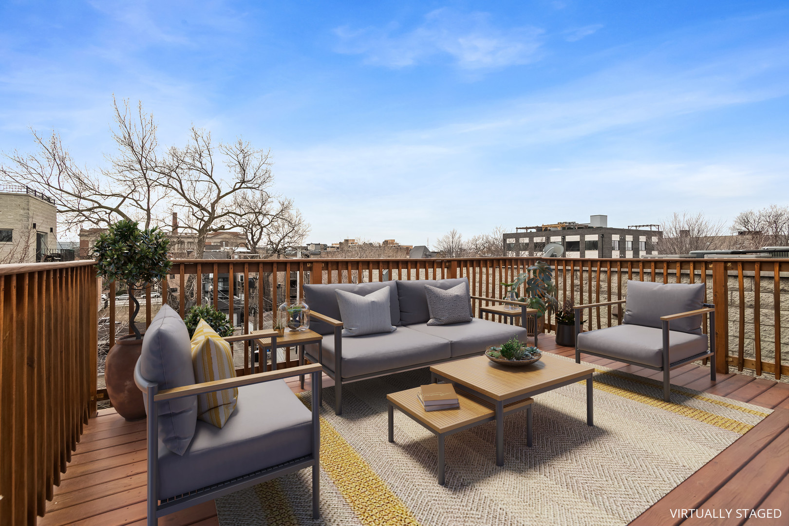2247 West Monroe Street, Unit 3 Chicago, IL 60612 - Photo 26 of 31 a roof deck with couches and wooden floor