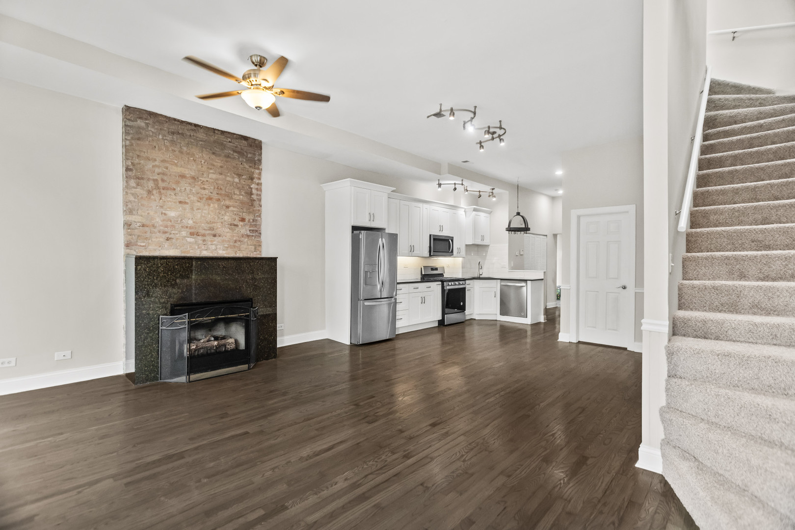 2247 West Monroe Street, Unit 3 Chicago, IL 60612 - Photo 4 of 31 a view of an empty room with a fireplace