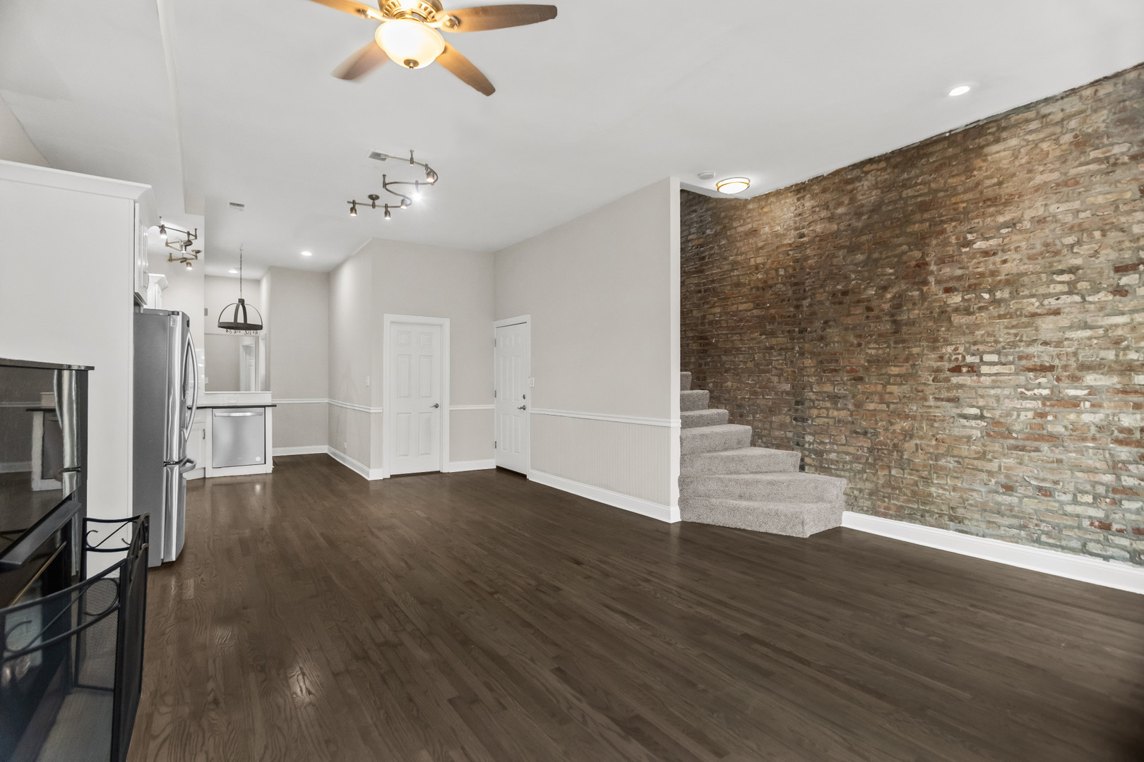 2247 West Monroe Street, Unit 3 Chicago, IL 60612 - Photo 5 of 31 a view of empty room with wooden floor and ceiling fan
