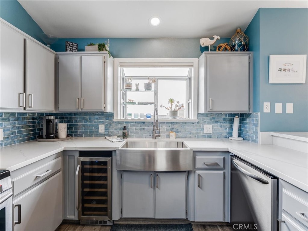 554 Cambridge Street Cambria, CA 93428 - Photo 18 of 52 a kitchen with cabinets appliances a sink and a counter top space