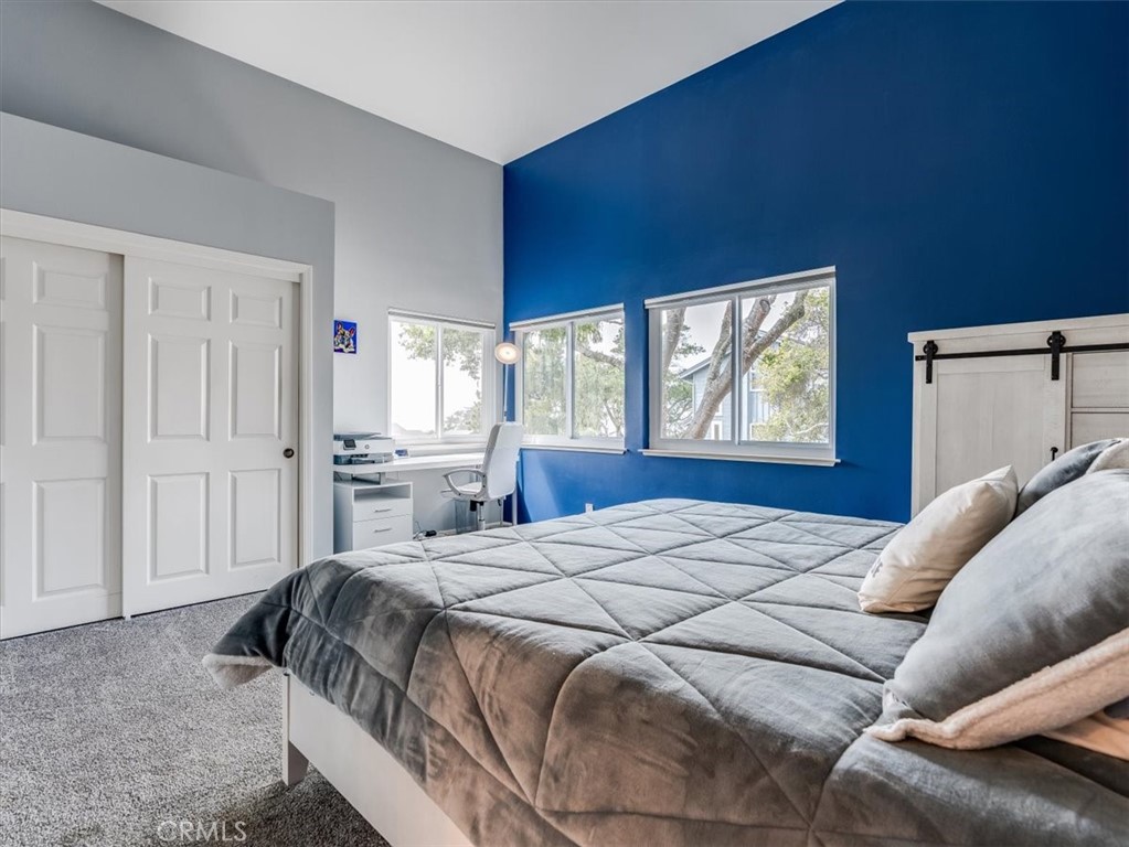 554 Cambridge Street Cambria, CA 93428 - Photo 23 of 52 a bed sitting in a bedroom next to a window