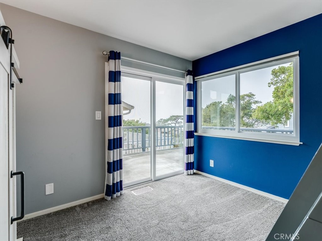 554 Cambridge Street Cambria, CA 93428 - Photo 31 of 52 Bedroom #3 also has ocean view and deck access.