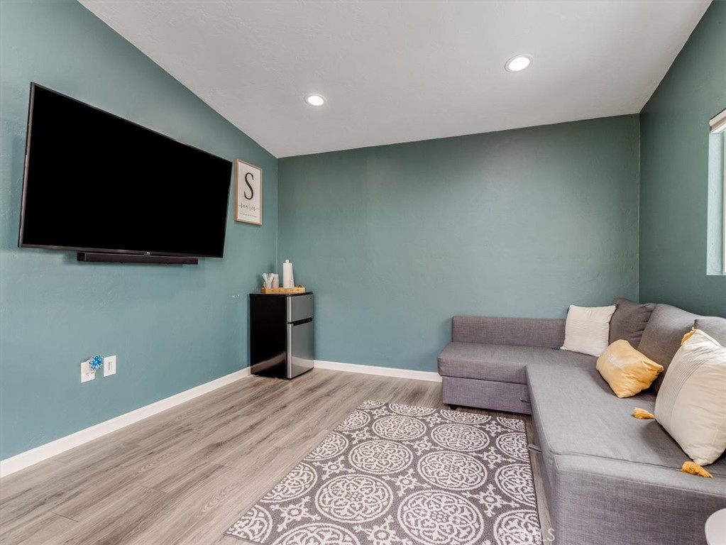 554 Cambridge Street Cambria, CA 93428 - Photo 36 of 52 a bedroom with a bed and a flat screen tv