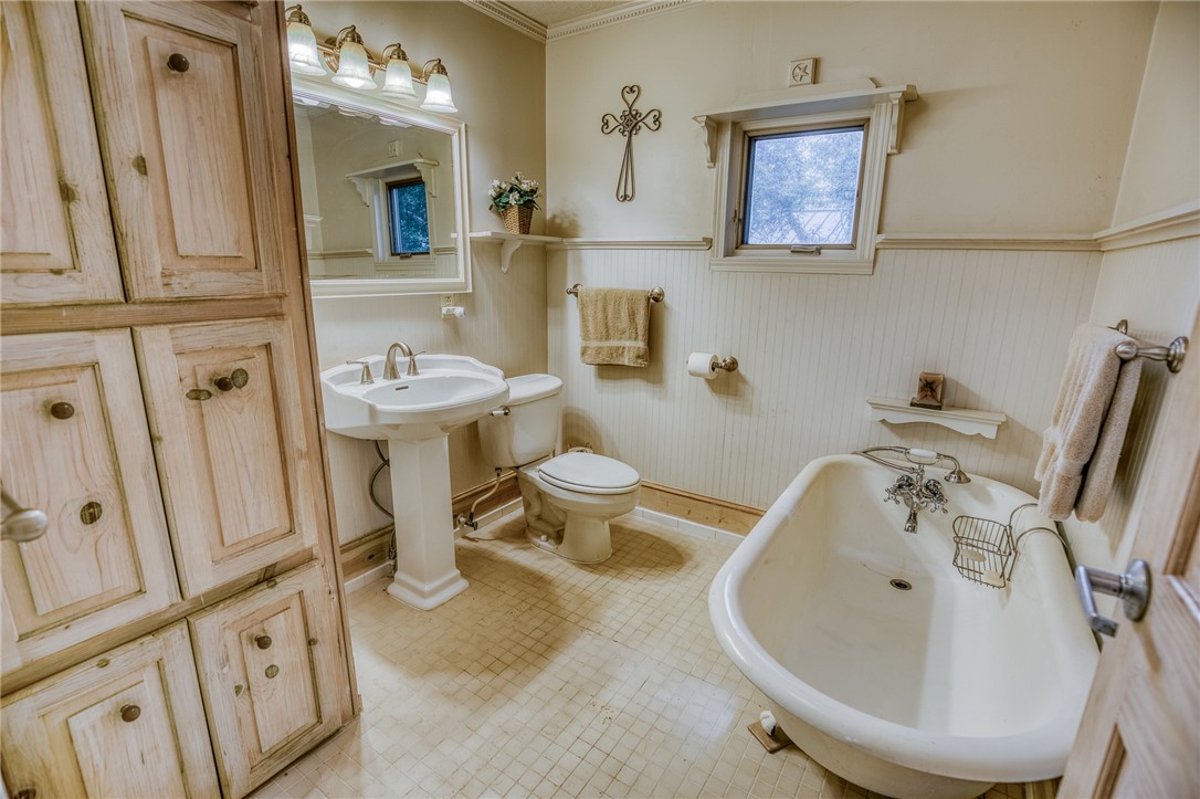 2330 County Road 329 Milano, TX 76556 - Photo 13 of 45 a bathroom with a sink mirror and toilet