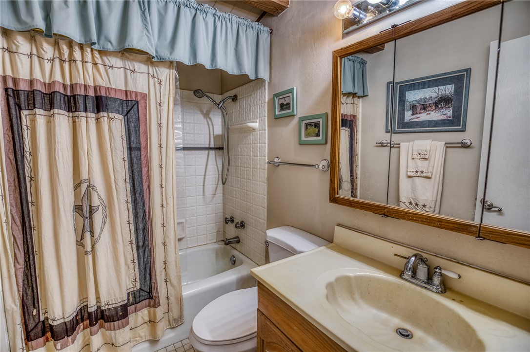 2330 County Road 329 Milano, TX 76556 - Photo 25 of 45 a bathroom with a sink toilet and shower