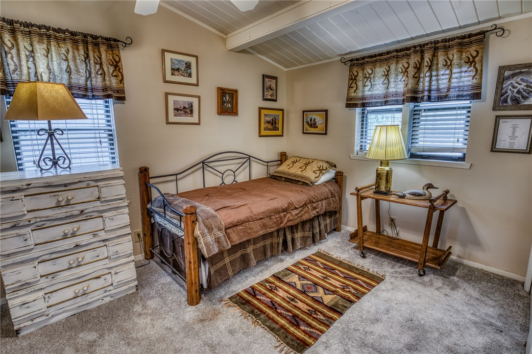 2330 County Road 329 Milano, TX 76556 - Photo 26 of 45 a bedroom with a bed and a night stand