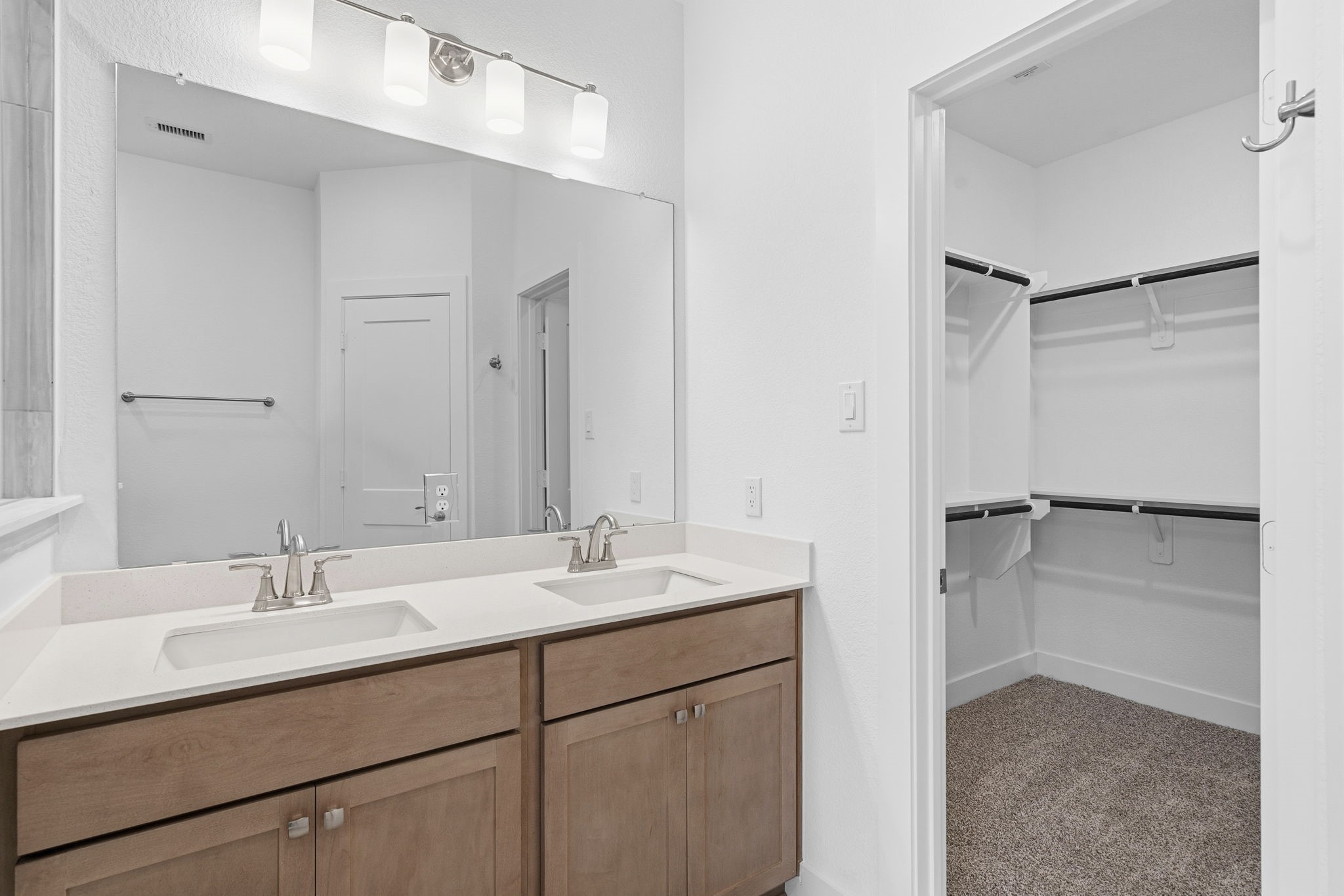 5251 Celestial Court Rosharon, TX 77583 - Photo 24 of 46 a bathroom with a double vanity sink mirror and shower
