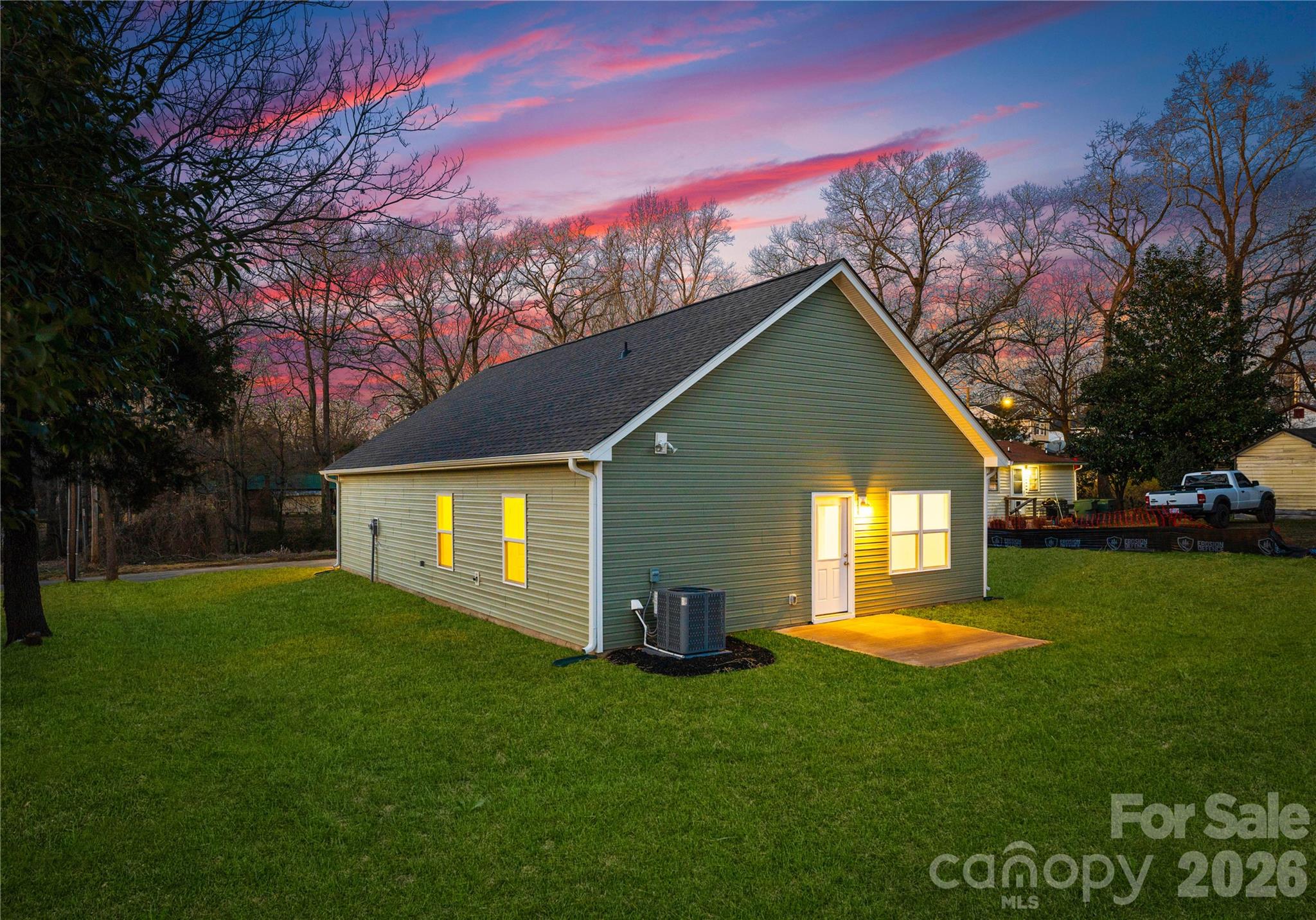 224 Rhyne Station Road Charlotte, NC 28214 - Photo 16 of 17 a front view of a house with a garden and yard