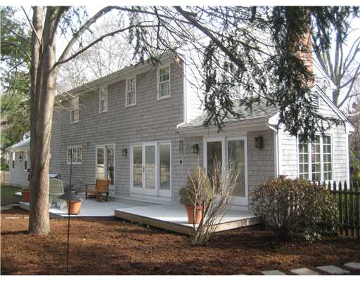 14 Cold Spring Road Barrington, RI 02806 - Photo 3 of 12 Exterior Back. There are sliding glass doors leading to the fenced back yard from the breakfast room, dining room and office.