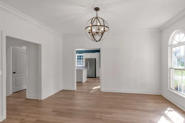 a balcony with wooden floor and fence
