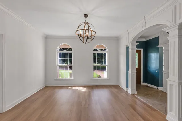 a front view of a house with swimming pool yard fire pit and barbeque oven