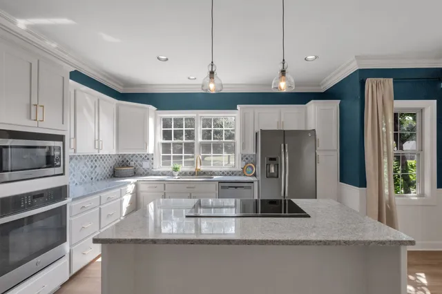 an aerial view of a house with yard swimming pool and outdoor seating