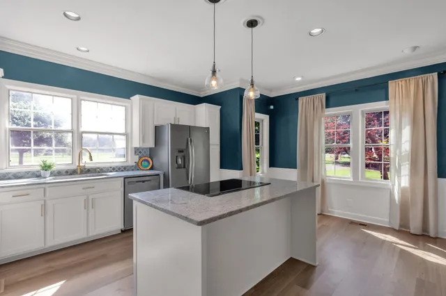 an aerial view of a house with garden space and street view
