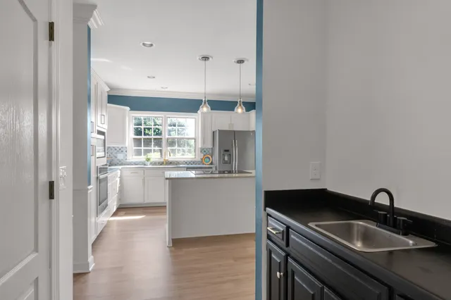 an aerial view of a house with outdoor space and pool