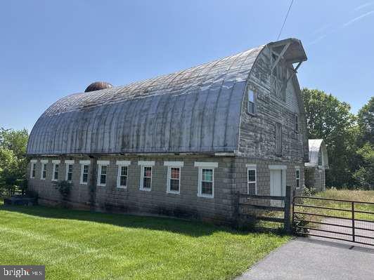 8212 Sixes Bridge Road Keymar, MD 21757 - Photo 2 of 3 a view of a house with a yard