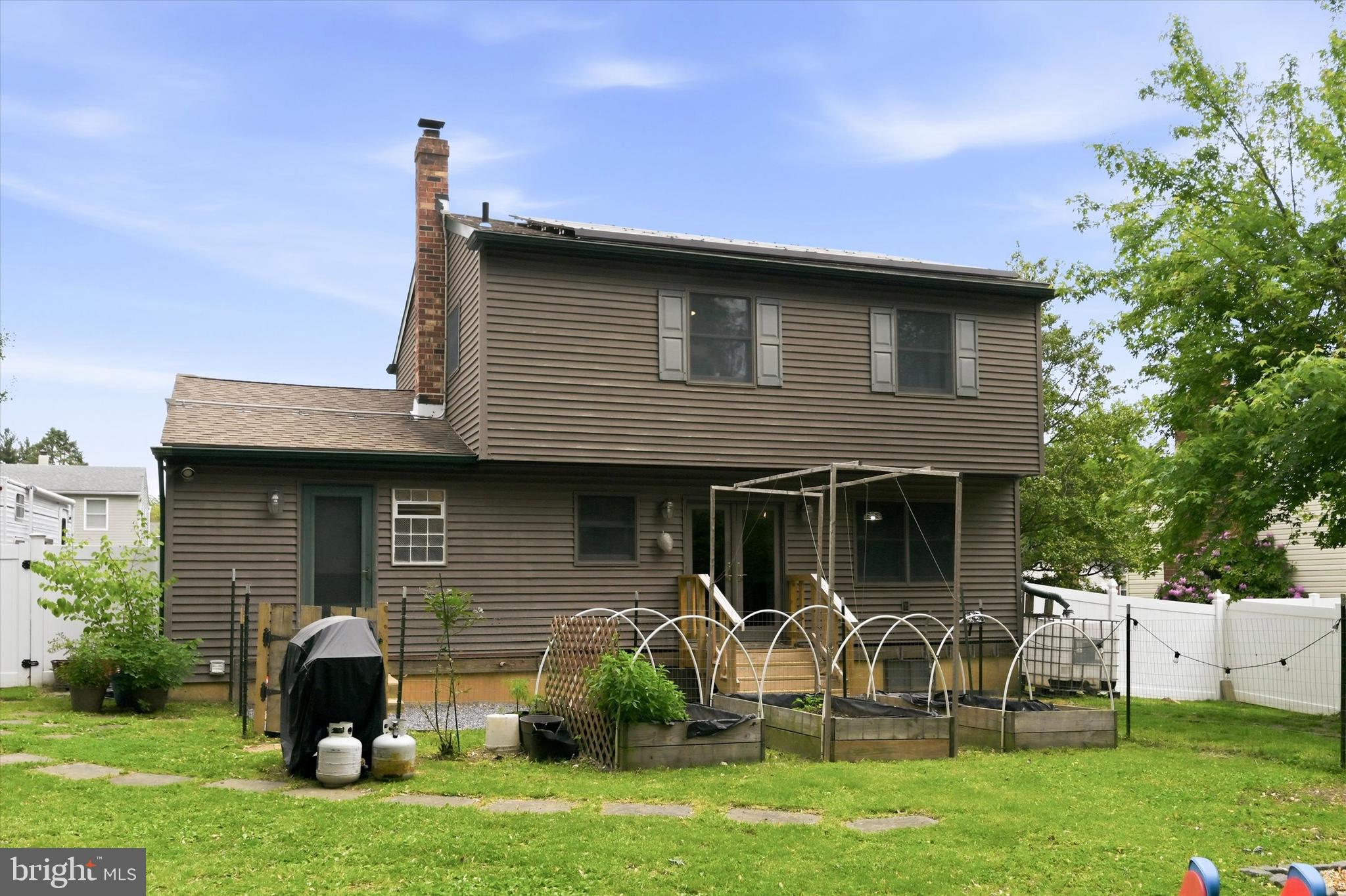 319 Willowbrook Road Upper Chichester, PA 19061 - Photo 23 of 24 a front view of a house with a garden and plants