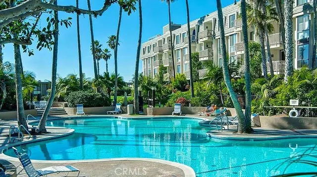 a view of a swimming pool with a patio
