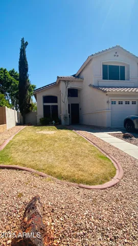 a house view with a swimming pool in front of it