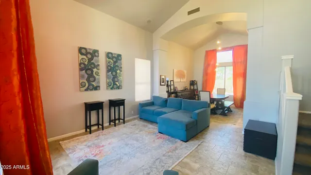 a living room with furniture and a window
