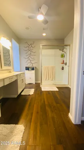 a spacious bathroom with a tub and shower