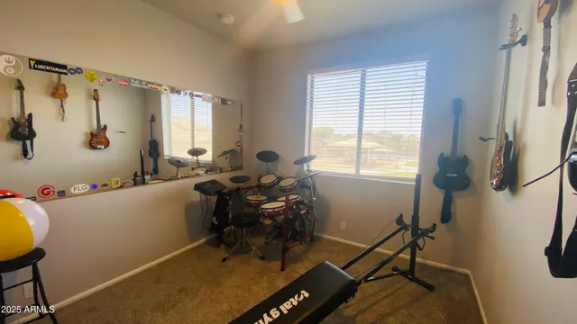 a room with table chairs and windows