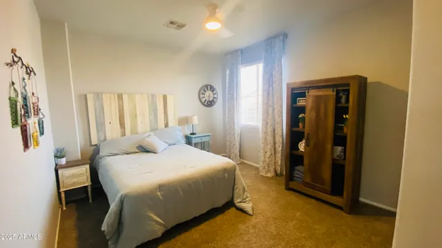 a bedroom with a bed and a table