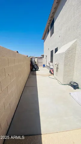 a view of a backyard of the house