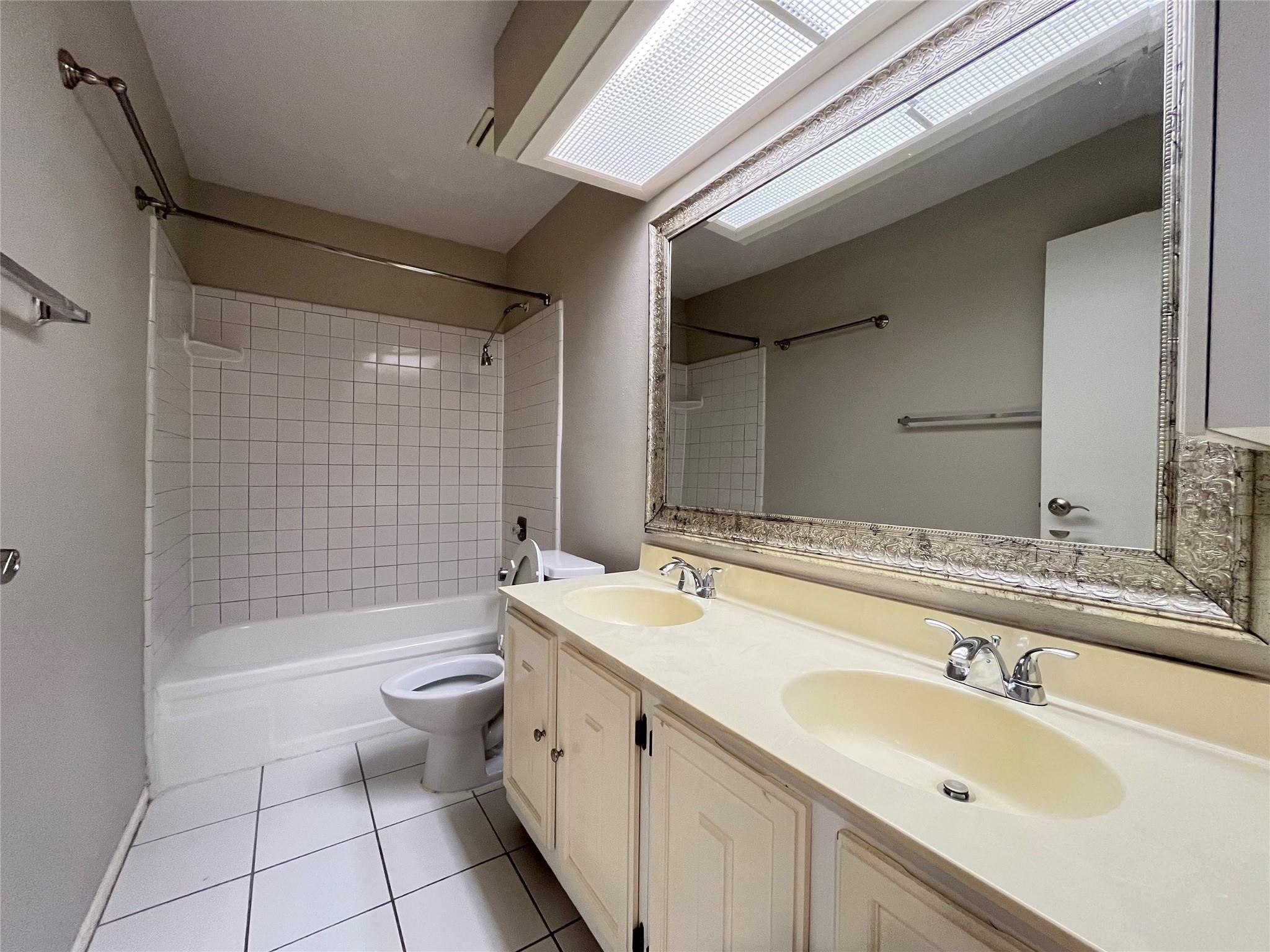 17 Briervine Court Spring, TX 77381 - Photo 14 of 19 a bathroom with a double vanity sink toilet and shower