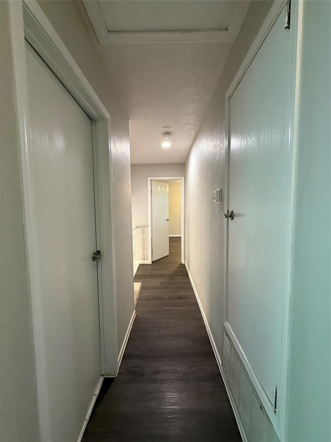 17 Briervine Court Spring, TX 77381 - Photo 10 of 19 a view of a hallway with wooden floor