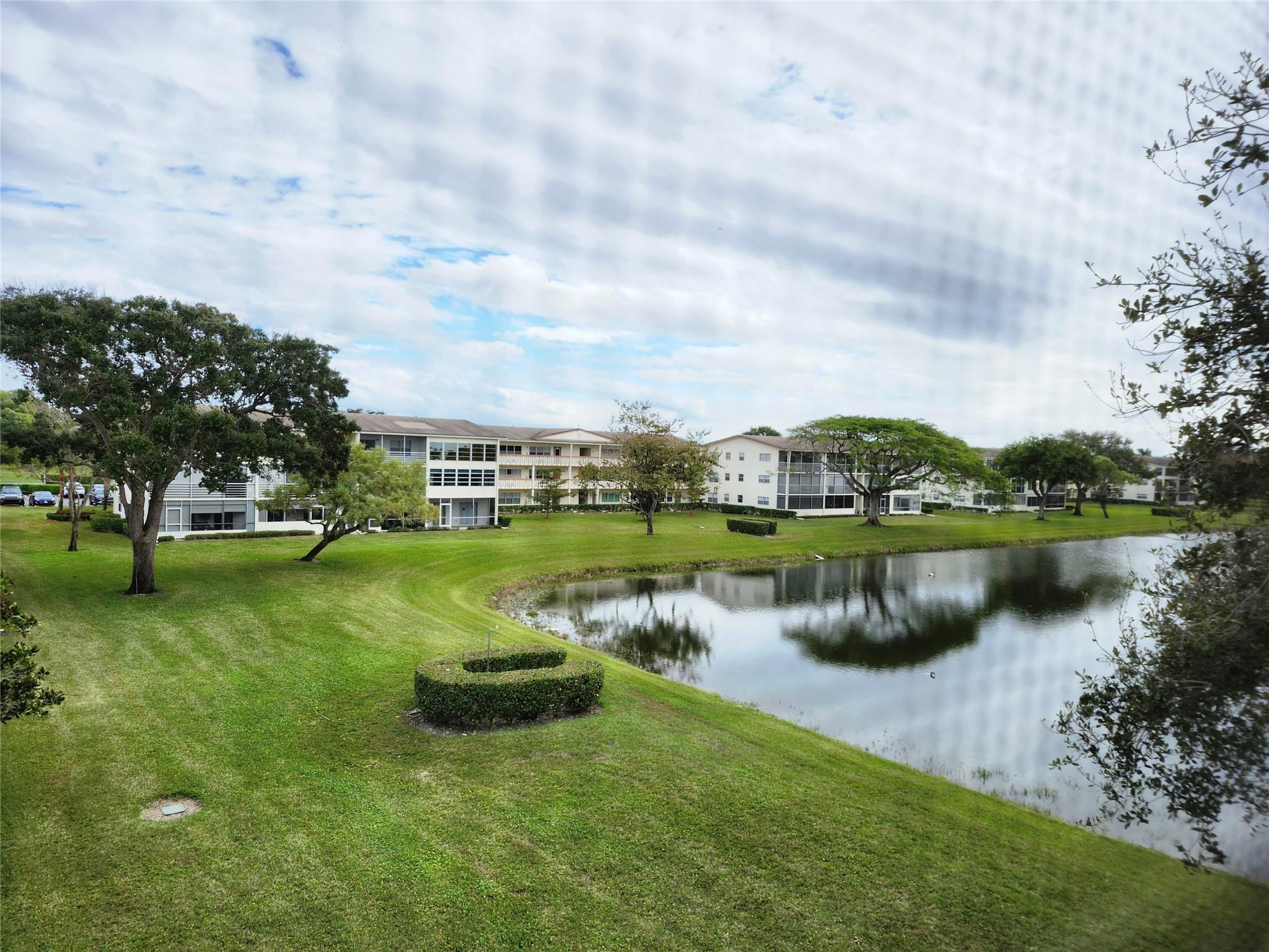 74 Preston Way Boca Raton, FL 33434 - Photo 21 of 28 a view of a lake with houses in the back