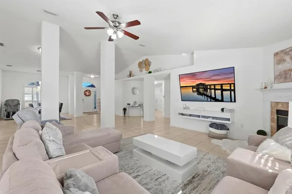 a living room with furniture and a fireplace