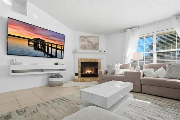 a kitchen with stainless steel appliances granite countertop a stove top oven a sink dishwasher and a refrigerator