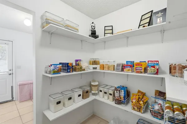 a kitchen with stainless steel appliances kitchen island granite countertop a sink and cabinets