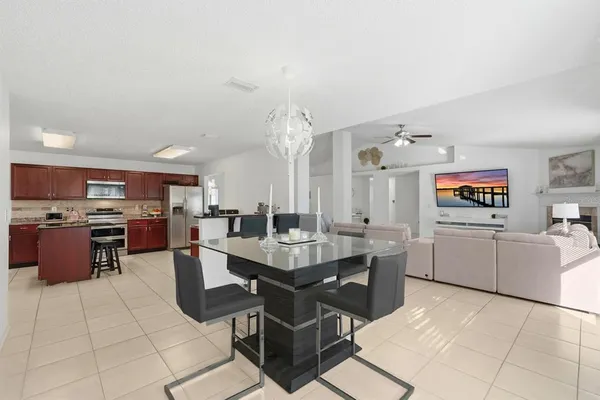 a living room with furniture and a book shelf