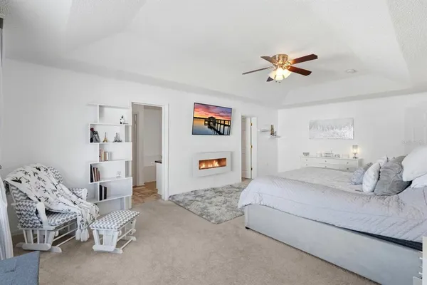 a spacious bathroom with a granite countertop sink and a mirror