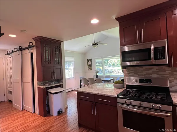 a kitchen with a refrigerator stove and sink