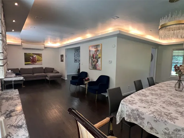 a living room with furniture and a table