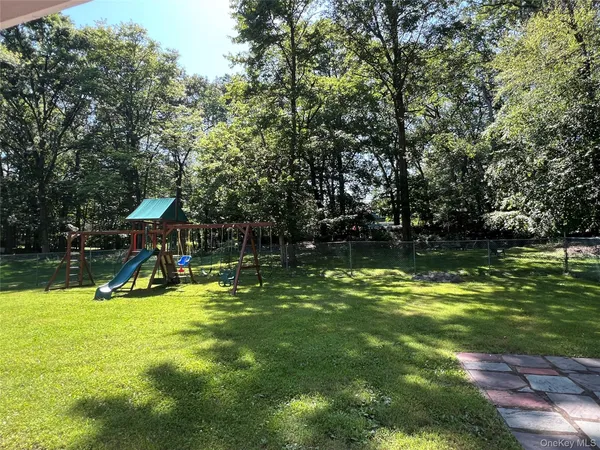 a view of a swimming pool with a yard