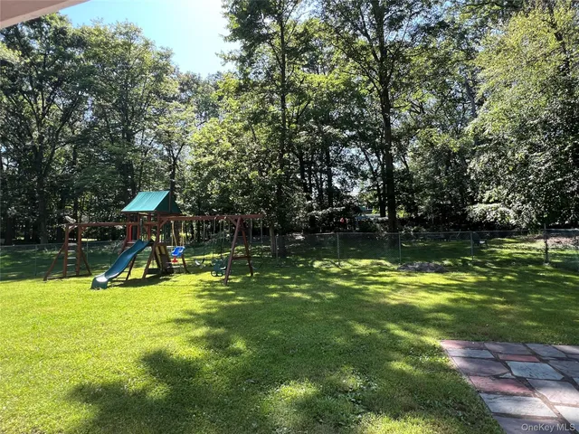 a view of a swimming pool with a yard
