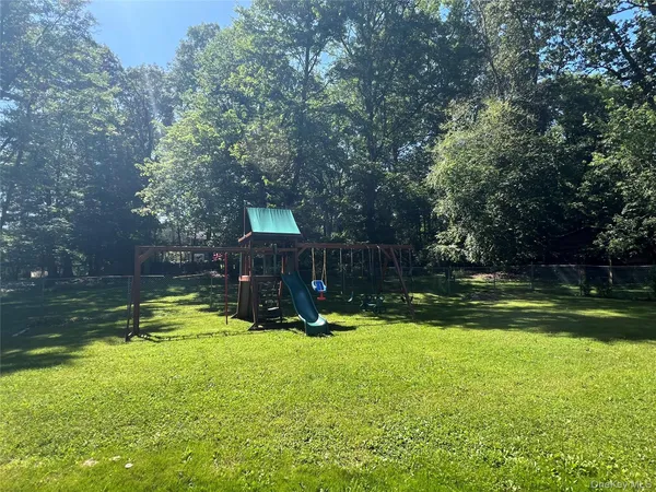 a view of swimming pool with a yard