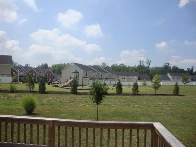 a view of a garden with houses