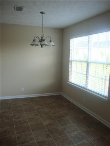 1947 Odessa Avenue Murfreesboro, TN 37128 - Photo 5 of 10 a view of a room with a chandelier fan and windows