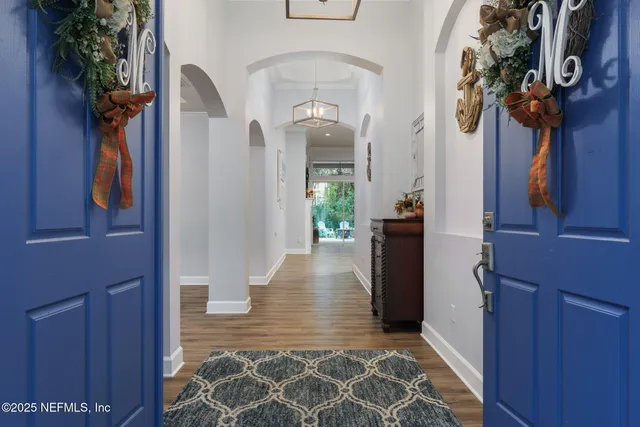 a living room with furniture flat screen tv and a window